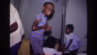 Harlem New York USA (1976): Happy Little Boy Dances And Smiles With Sister In The