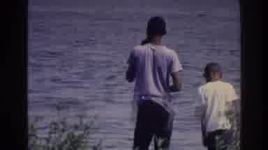 Harlem New York USA (1976): Three Kids Are Standing The Waters Edge Of A Lake