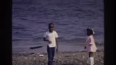 Harlem New York USA (1976): Two Children Playing On The Beach And Throwing Rocks