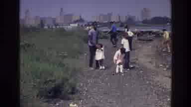 Harlem New York USA (1976): People Adult Children Strolling Beside River And Grass