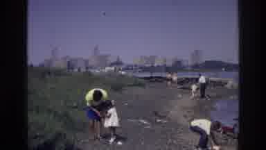 Harlem New York USA (1976): Mother And Daughter Stand On Rocky Shore Together