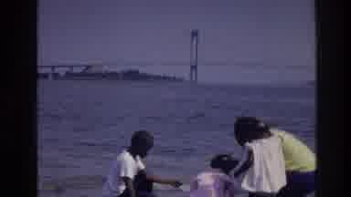 Harlem New York USA (1976): Children Throwing Rocks In The Ocean And Making