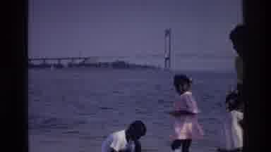 Harlem New York USA (1976): Three Kids Playing In Sea Shore With A Lady