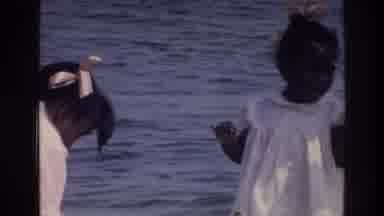 Harlem New York USA (1976): Man With Two Girls Wearing Dresses Standing On Lake