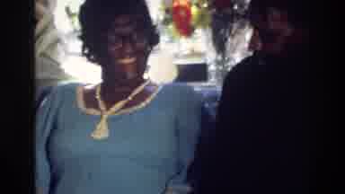 Harlem New York USA (1976): Woman Reads A Card Sitting Next To A Man And Someone