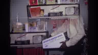 Harlem New York USA (1976): The Room Is Full Boxes And A Boy Sets Down A Box Into