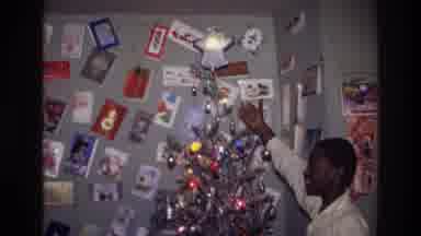 Harlem New York USA (1976): African American Teenager Showing Off His Christmas