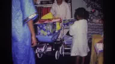 Harlem New York USA (1976): Kids And One Adult Look Over Christmas Presents