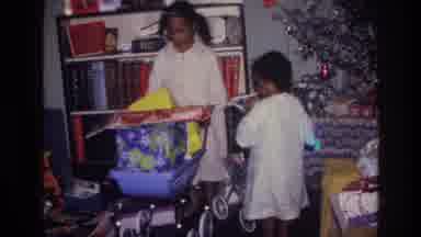 Harlem New York USA (1976): Young African American Girls Look Over Christmas