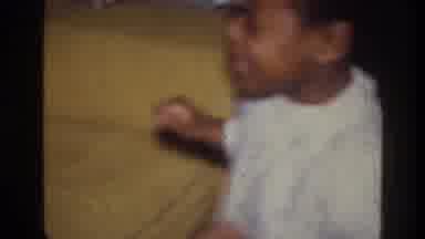 Harlem New York USA (1976): Young Girl In Nightgown Receiving Gifts Of Some Sort