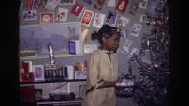 Harlem New York USA (1976): African Family Opening Christmas Present Under The