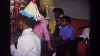 Harlem New York USA (1976): Kids Dancing At A Birthday Party, Adult Smoking A Pipe