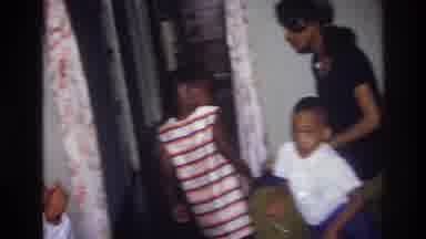 Harlem New York USA (1976): Group Of Adults And Children Dancing And Wearing Party