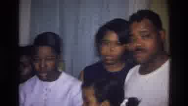 Harlem New York USA (1976): African American Family Standing Around Looking At
