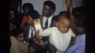 Harlem New York USA (1976): Group Of People Of All Ages Dressed Nicely And Someone