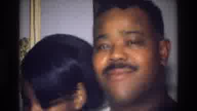 Harlem New York USA (1976): Man And Woman And Baby Indoors Near A Picture Frame