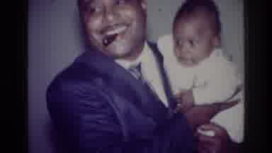 Harlem New York USA (1976): Main In Suit Holding A Baby And Little Girl