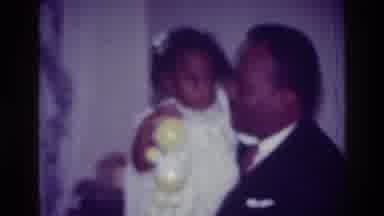 Harlem New York USA (1976): Man In A Suit Talks To A Very Young Girl In A Party
