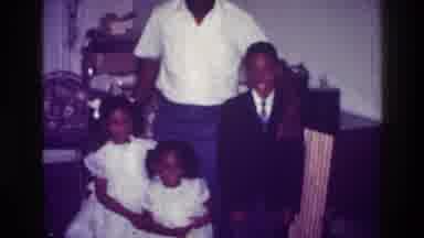 Harlem New York USA (1976): Man Poses With Three Kids Dressed In Formal Attire