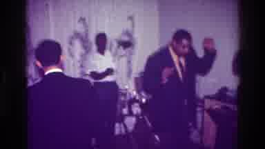 Harlem New York USA (1976): Mother Holds Baby While The Man Rocks On The Dance