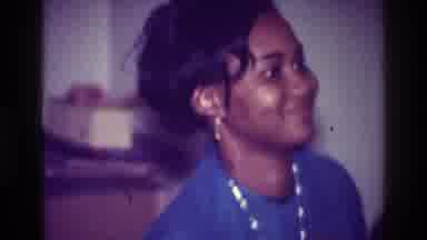 Harlem New York USA (1976): A Woman Of Color Wearing A Blue Dress Lifts Her Girl