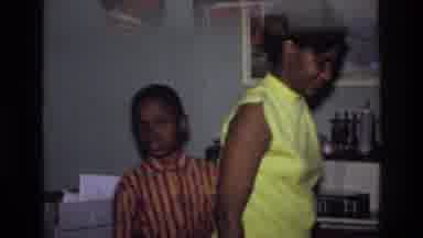 Harlem New York USA (1976): Vintage Interior Domestic Scene Showing Mother Picking