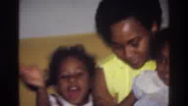 Harlem New York USA (1976): Happy Young Girl Waves At Camera Near Sibling And
