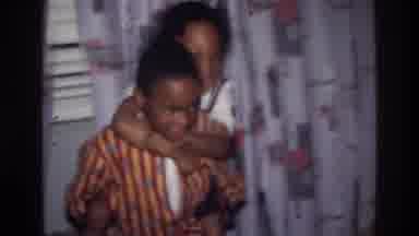 Harlem New York USA (1976): Siblings Play Animatedly In The Living Room Of Their