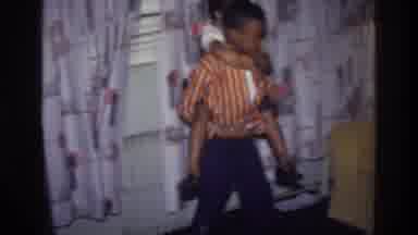 Harlem New York USA (1976): Two Black Children Playing In The House With The Sofa