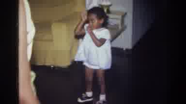 Harlem New York USA (1976): Small Girl Looks On As Boy Roughhouses Another Child