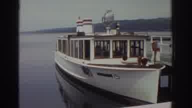 Watkins Glen New York USA-1976: Kids And Mom On A Motorboat To Travel To Another