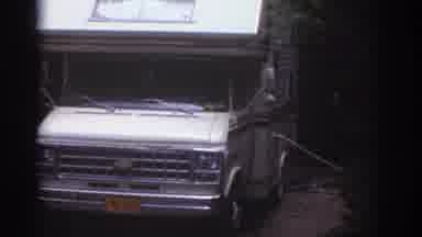 Watkins Glen New York USA (1976): Camper Van Is Parked Outside Near Picnic Table