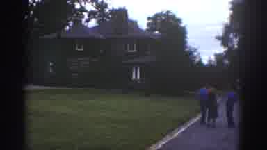 Watkins Glen New York USA (1976): Parked Camper With Four People Standing In The