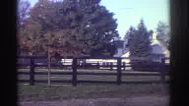 Watkins Glen New York USA (1976): A Glimpse Of A Man And Woman Are Seen As A House