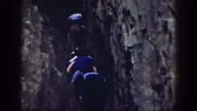 California USA (1937): Two Groups Of People Either Rock Climbing Or Fishing