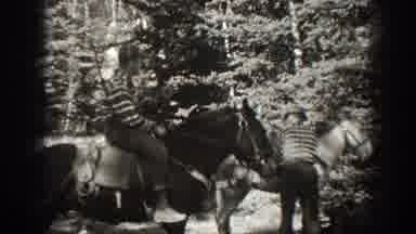 California USA (1938): People On A Horse In The Forest Possibly Hunting For Food