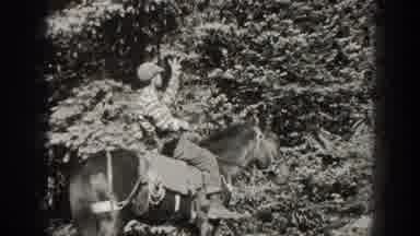 California USA (1938): Man Seated On Horse Makes Hand Signals Splayed Fingers Then