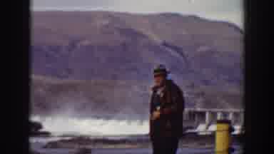 California USA (1938): Detective Looking Man Near A Mountain Waving Awkwardly Then