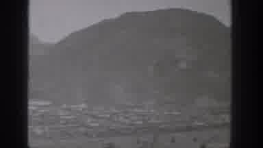 Washington USA (1938): A Water Dam Has Water Flowing Over It As The Valley Below