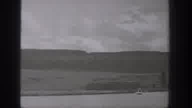 Washington USA (1938): Person Riding Motorized-Surf-Device In A Lake With