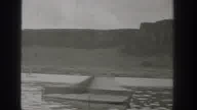 Washington USA (1938): Driving A Boat Amidst A Lake In A Beautiful Mountainous