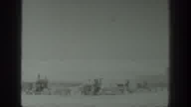 California USA (1939): Man Stands In Field To Film Farm And Harvest Machine