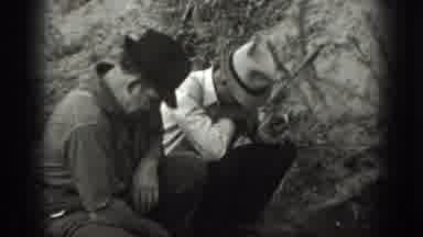 California USA (1939): Two People Walking Through A Lush Forest