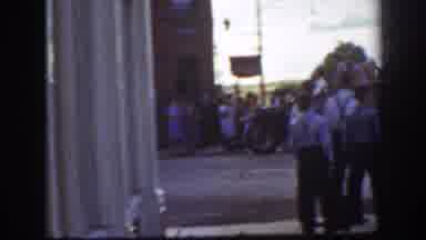 California USA (1939): People Gathering On Sidewalks To Watch Small Parade On