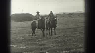 Montana USA (1939): Couple In Love Riding Horses In The Ranch While Holding Hands