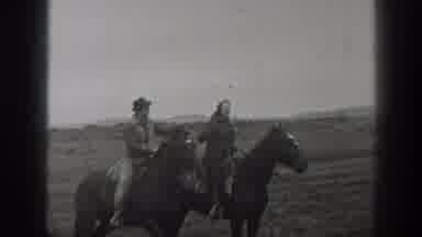 Montana USA (1939): A Man And Women Share A Kiss While They Sit On Separate Horses