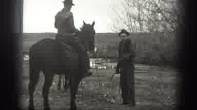 Montana USA (1939): Men Riding Horses Are Herding The Cows Into The Stable