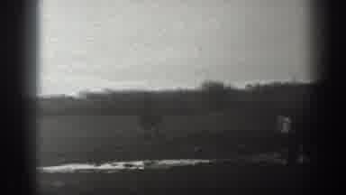 Montana USA (1939): A Man Riding A Horse Across A Muddy Field Out In The Country