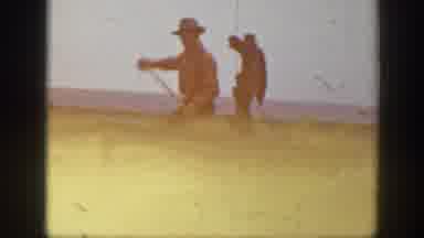 Montana USA (1939): Two Men One Bailing Hay Off Of A Cart Full Of Hay