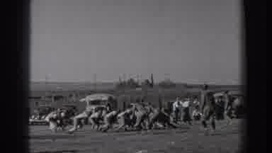 WASHINGTON USA-1939: Youth Football Game with Tackling on Dirt Field